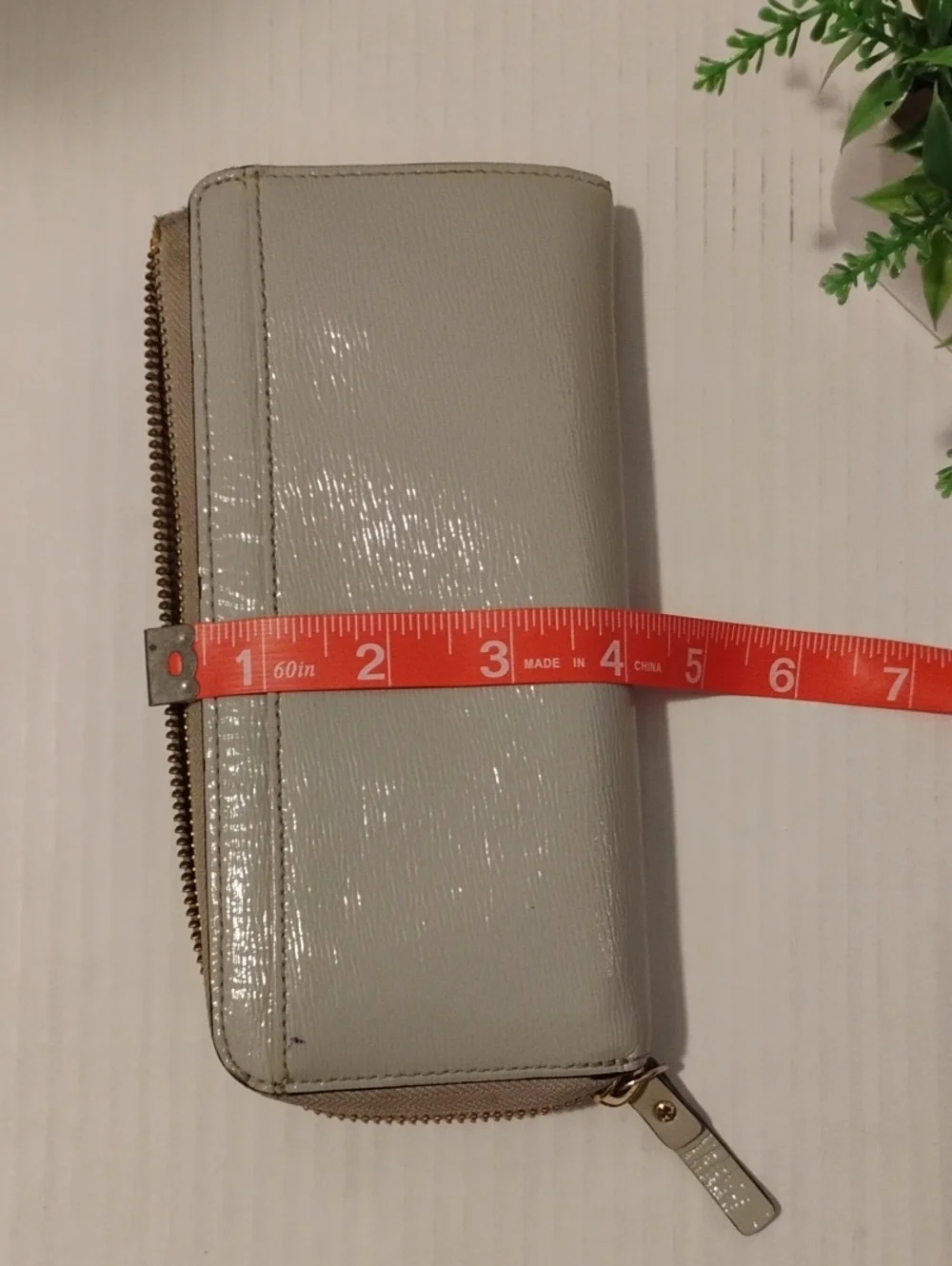 kate spade Beacon Court Nisha Wallet. Patent Leather. Light Gray in color.
